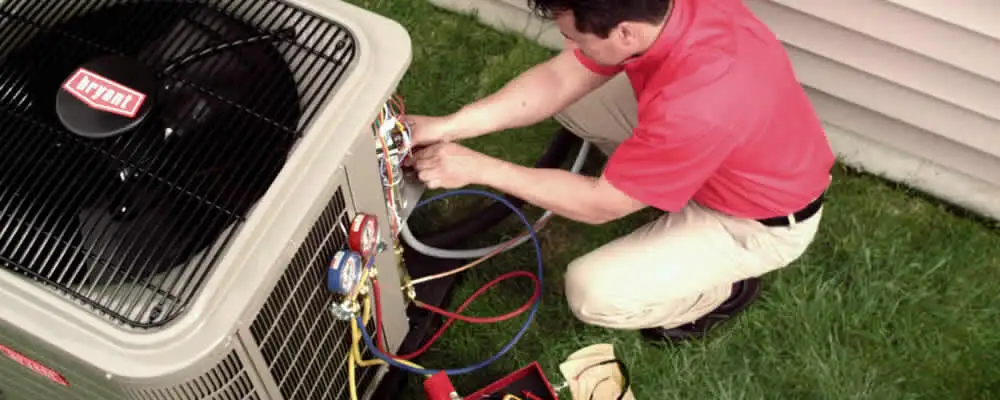 HVAC technician servicing an outdoor air conditioner unit in Pasadena, CA
